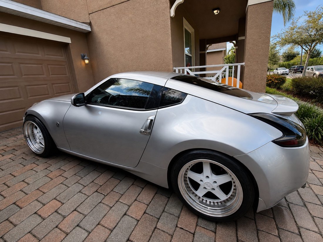 Freshly detailed silver Nissan 370Z with a mirror-like finish