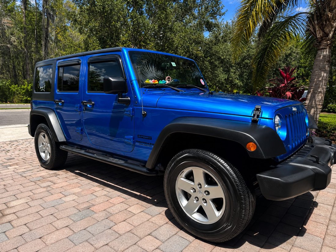 Freshly detailed glossy blue Jeep Wrangler Unlimited